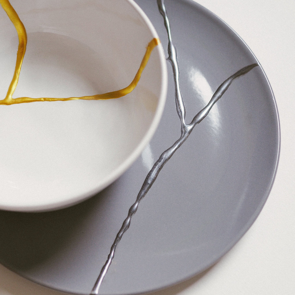 Kintsugi plates on gold and silver